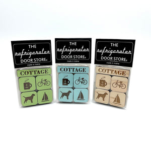 Set of cottage-themed wooden magnets by 163 Design Company, featuring charming miniature houses and scenic countryside details.