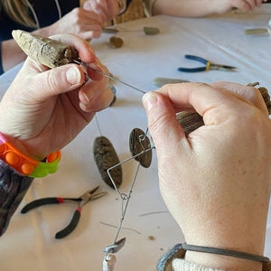 Watercolor and nature mobiles from Down East Adventures Coastal Creativity Workshop, featuring colorful handcrafted watercolors and hanging mobiles.