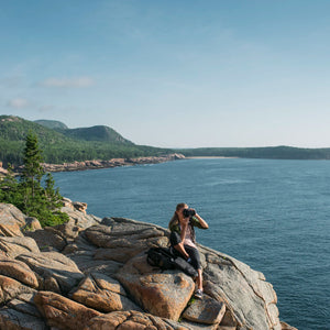 Photograph of a scenic Acadia landscape taken during Down East Adventures photography workshop, showcasing rugged coastline and lush greenery.