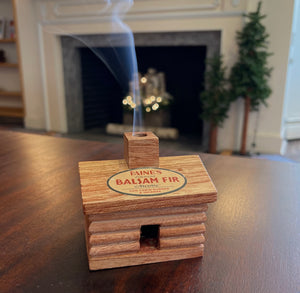 Paine Products Cabin Incense Burner featuring a rustic wooden cabin design with a chimney and detailed exterior.