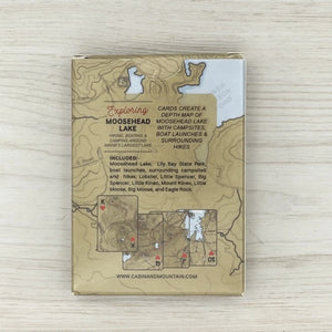 Exploring Moosehead Lake playing cards by Cabin & Mountain featuring scenic lake and mountain illustrations on the card backs.