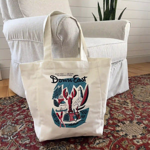 Down East Vintage Cover canvas tote bag with leather handles, stylishly displayed in a lifestyle setting.