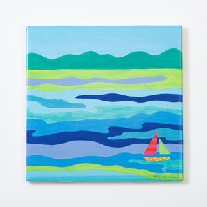 Blue ceramic festive fish trivets by Festive Fish featuring vibrant holiday-inspired design on durable heat-resistant surface.