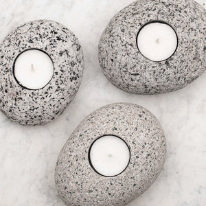 Beach Stone Candle by Funky Rock Designs featuring a natural stone candle with a rustic, coastal-inspired design.