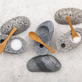 Beach stone salt cellar by Funky Rock Designs featuring a natural, textured stone container for storing salt.