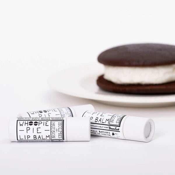 Multiple eco-friendly paper tubes of whoopie pie lip balm next to whoopie pie