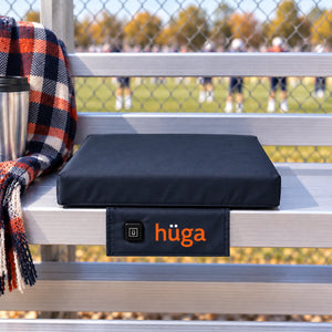 Hüga Heat heated cushion in use, showing soft fabric cover and cozy design perfect for relaxing and warmth.