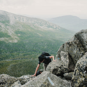 Scenic view of Mount Katahdin during a hiking trip with hikers on the trail, captured in a landscape photo by Down East Adventures.