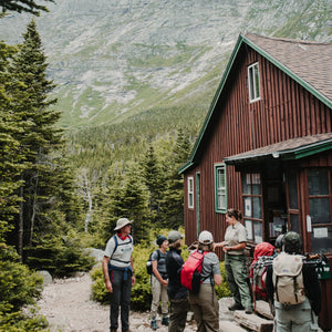 Katahdin Hiking Trip by Down East Adventures showing a scenic mountain view of Mount Katahdin with hikers on the trail