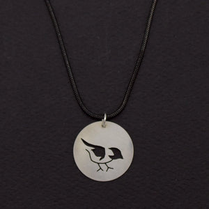 Sterling silver Chickadee disc pendant necklace by LSF Design + Fabrication, featuring a detailed bird design on a sleek round pendant.