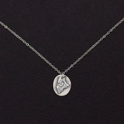 Sterling pendant necklace featuring the Relief State of Maine with a heart, crafted by LSF Design + Fabrication.