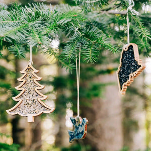 Maine Shellware crushed shell ornament with natural shell detail, displayed on a rustic wooden table.