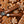 Marin Skincare Gingerbread Lip Treatment tube with festive gingerbread cookies in the background, showcasing nourishing lip care.