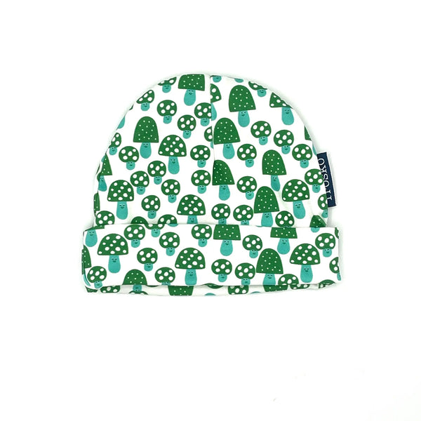 Baby hat with green mushroom pattern on a white background