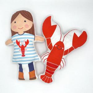 Nickwilljack Cut & Sew Lobster Kit featuring a girl and lobster plush toys on a white background