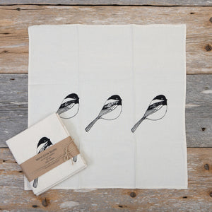 Four + North cloth napkin set with chickadee and circle design, featuring eco-friendly fabric and elegant table decor.