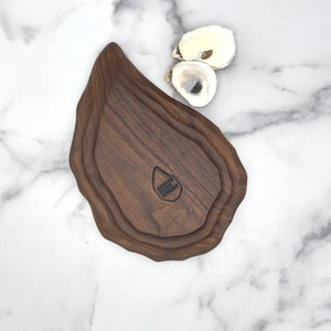 Hand-carved walnut oyster platter with six wells by Oyster River Joinery, showcasing detailed craftsmanship and natural wood grain.