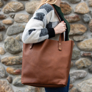 Brown Fore Street Leather Tote Bag by Rogue Industries showing sturdy leather construction and spacious interior for daily use.