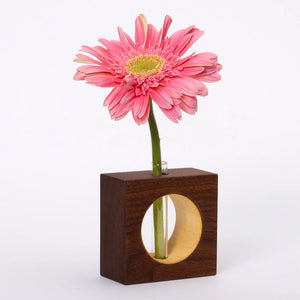 Walnut S.E. Hall Furniture bud vase with a sleek, modern design and smooth finish, perfect for floral arrangements or decorative display.