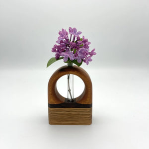 Elegant S.E. Hall Furniture Arch Bud Vase in mahogany, walnut, and white oak with a sleek, curved design for floral display.