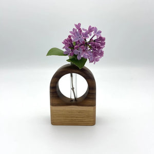 Walnut, maple, and white oak Arch Bud Vase by S.E. Hall Furniture with a sleek, curved design suitable for floral displays.