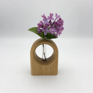 White oak Arch Bud Vase by S.E. Hall Furniture, featuring a sleek curved design ideal for floral arrangements.