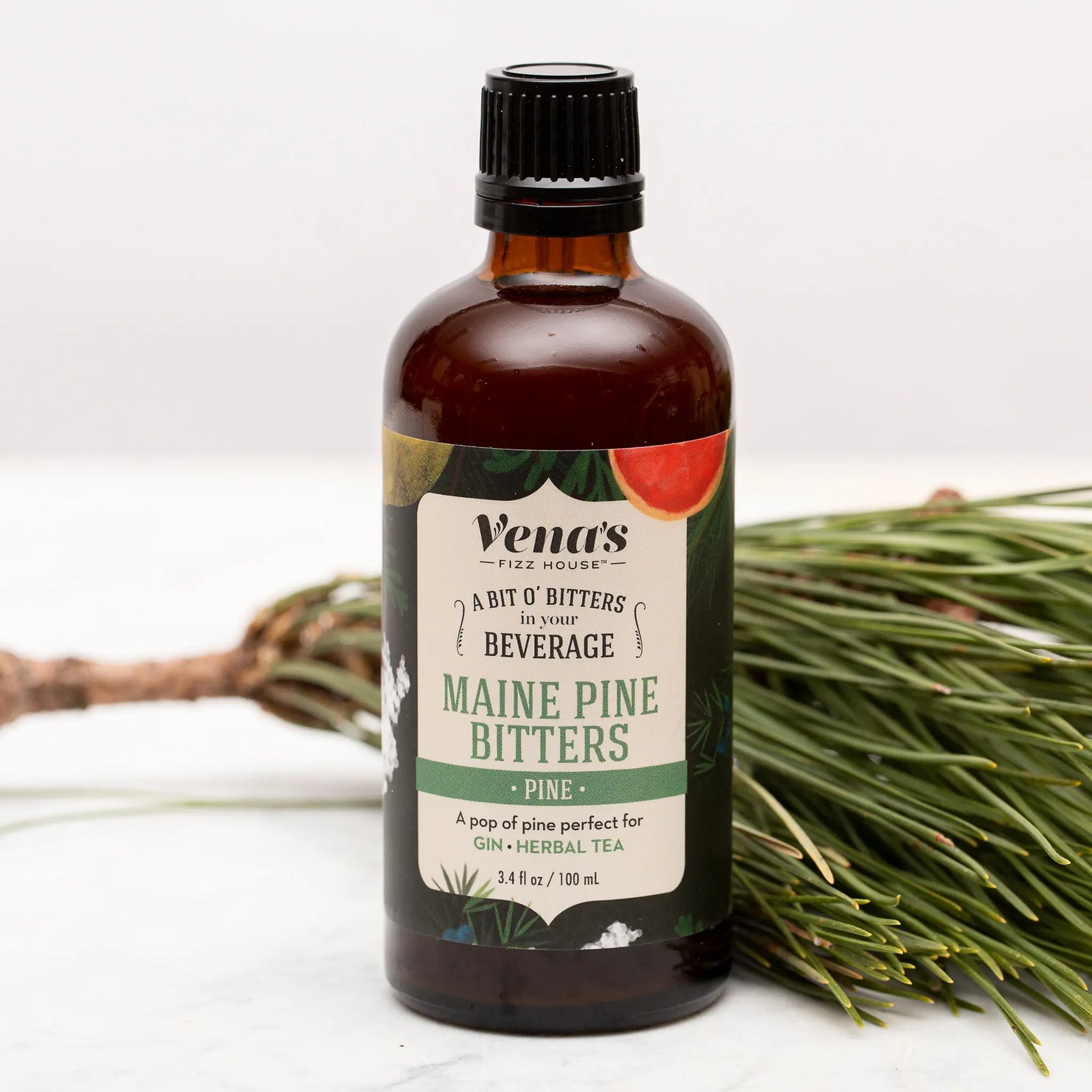 Vena's Fizz House Maine Pine Bitters bottle with label, showcasing natural pine flavor for cocktail crafting.