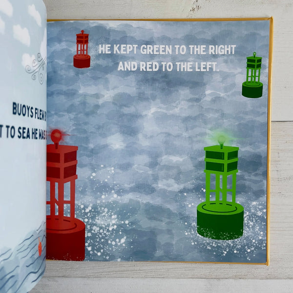 Open book with illustrations of buoys with red and green colors on a blue water background.