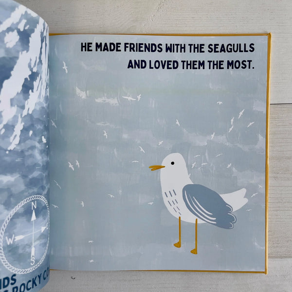 Open book with illustration of a seagull on a book page with text about making friends with seagulls.