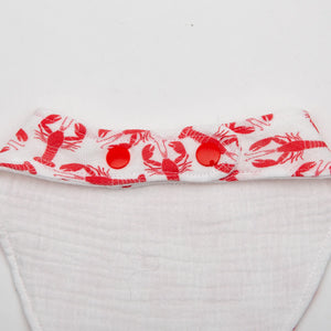 Adjustable baby bib from Baloo Baleerie featuring a red lobster design, made of soft, waterproof fabric for easy cleaning.