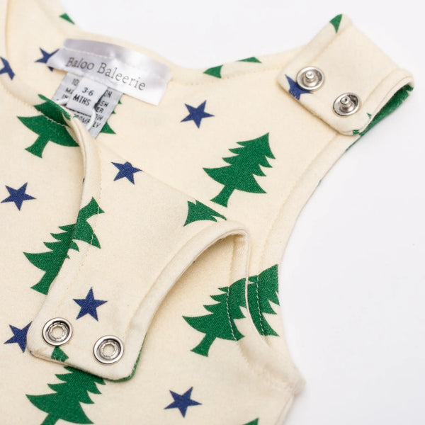 Baloo Baleerie close up views of child's cream romper with green pine trees and navy stars shoulder snaps