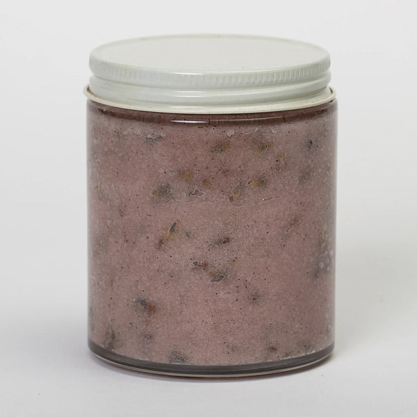 Bee Balm and Nettle back view of glass jar of hibiscus and lavender bath & shower scrub showing the flecks of hibiscus and lavender throughout the rose colored scrub