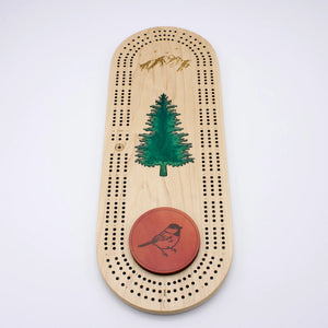 Cast & Carve Pine Tree Epoxy Cribbage Board featuring a detailed pine tree design and smooth epoxy finish.