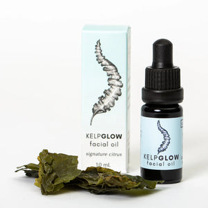 Cold Current Kelp KelpGlow Facial Oil mini bottle with citrus scent, showcasing the product's sleek packaging and vibrant label.