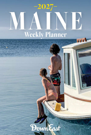 Down East Calendar Maine Weekly Planner Calendar open to a weekly view with dates and notes on white paper.