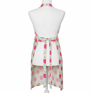Linen apron from Lola Arts with honeycomb pattern, featuring adjustable neck strap and front pockets for practical kitchen wear.