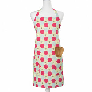 Linen apron by Lola Arts featuring a honeycomb pattern, tied at the waist with adjustable straps, ideal for cooking or baking.