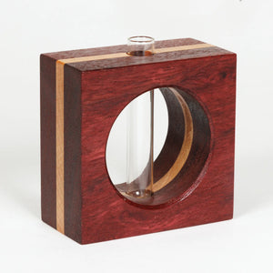 S.E. Hall Furniture bloodwood and maple bud vase with a smooth, rounded shape and natural wood finish.