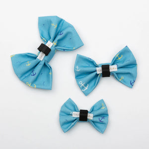 Group of colorful pet bows from Tealight Studios, featuring anchor and nautical designs for small pet accessories.