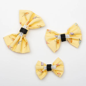 Group of tealight studios buoy pet bows in various colors, made of fabric with adjustable straps for comfortable fit.