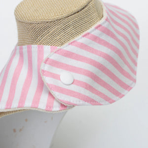 Pink baby bib with anchor pattern from Two Little Beans & Co., designed for infants to keep clothes clean during feeding.