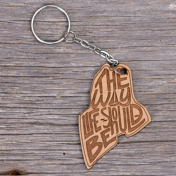 163 Design Company metal keyring with attached wooden shaped Maine with the words THE WAY LIFE SHOULD BE