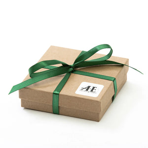 Slate magnet set by A&E Stoneworks featuring natural slate pieces with magnetic backing, displayed in a Maine-themed box.
