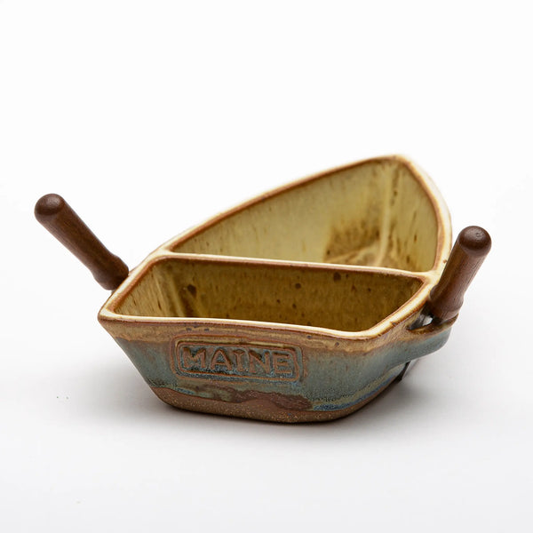 Ash Cove Pottery rear view of pottery double dip dinghy dish with two appetizer knives in oar locks and MAINE stamped on stern