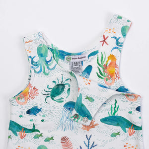 Baloo Baleerie closeup of child's light mint romper with colorful sea creatures repeated design and 2 snap closure on both shoulders showing one side unsnapped