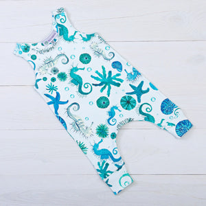 Baloo Baleerie child's mint romper with turquoise and teal starfish, sea urchin, seahorse repeated design and 2 snap closure on both shoulders