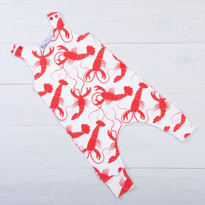 Baloo Baleerie child's white romper with red lobsters repeated design and 2 snap closure on both shoulders