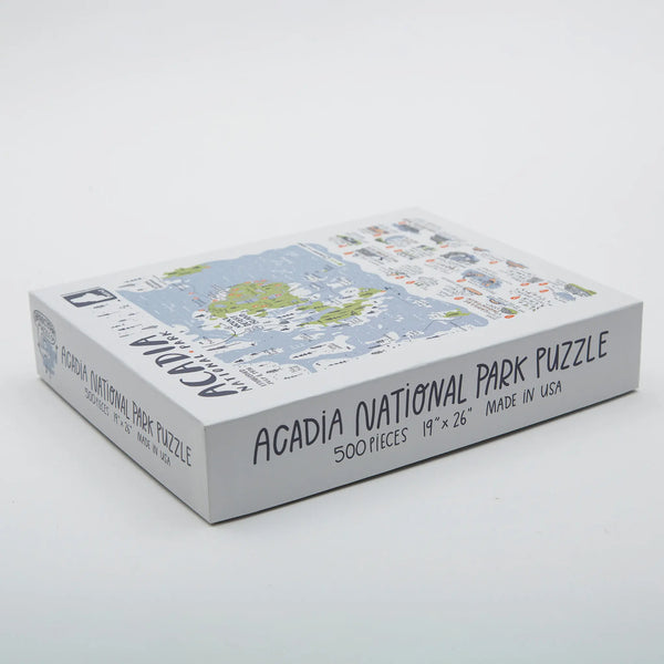 Brainstorm side view of boxed Acadia National Park map puzzle in white, light green, and light blue with area doodles of points of interest marked with information