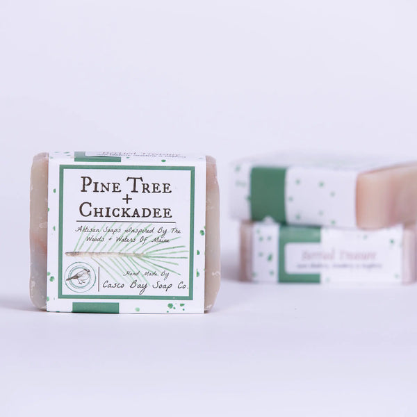 Casco Bay Soap Company bar of berried treasure soap with pine tree + chickadee design wrap