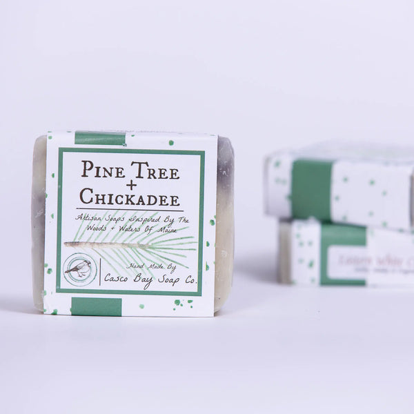 Casco Bay Soap Company bar of eastern white cedar soap with pine tree + chickadee design wrap